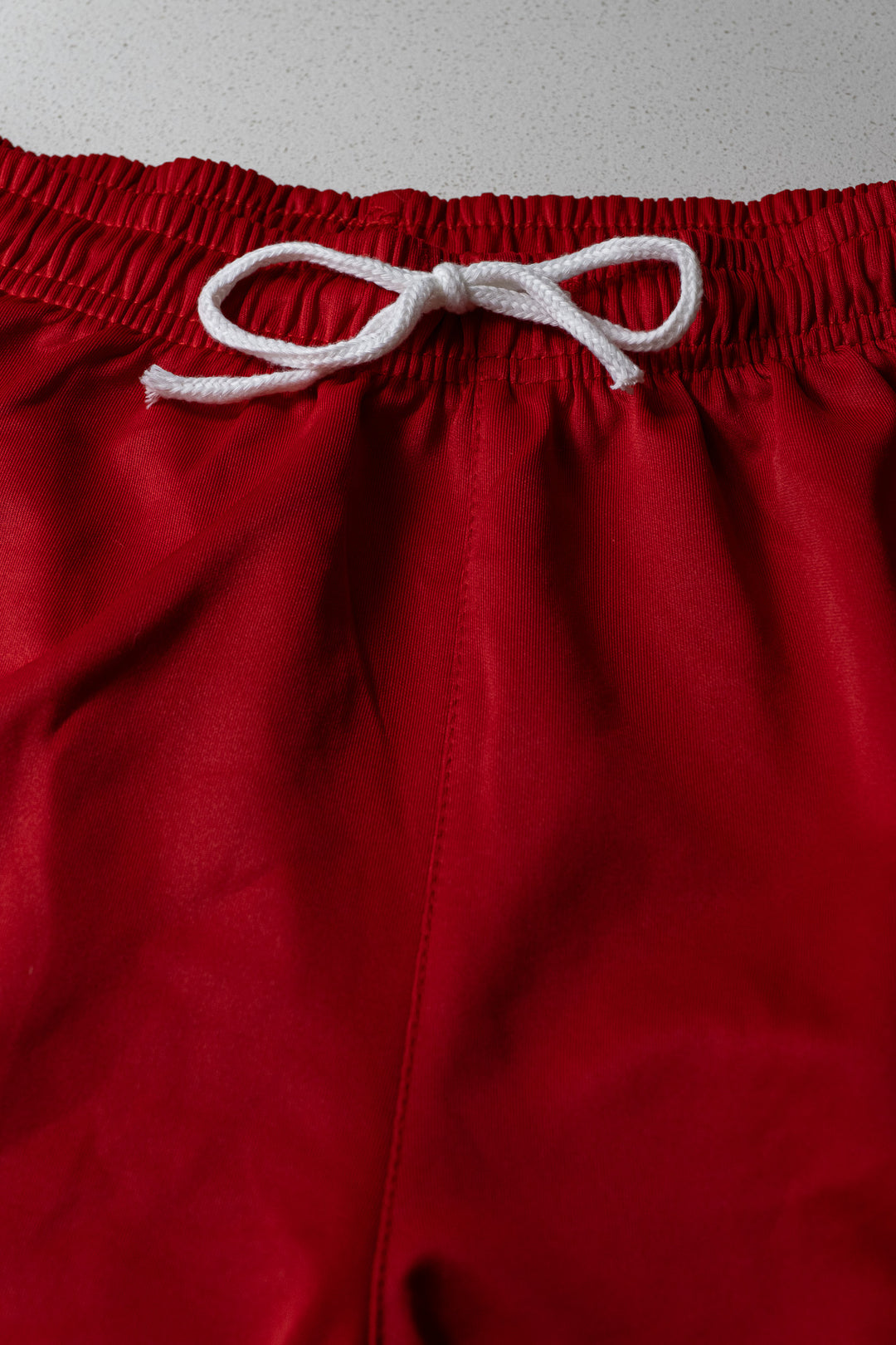 RED STRIPED GYM SHORTS