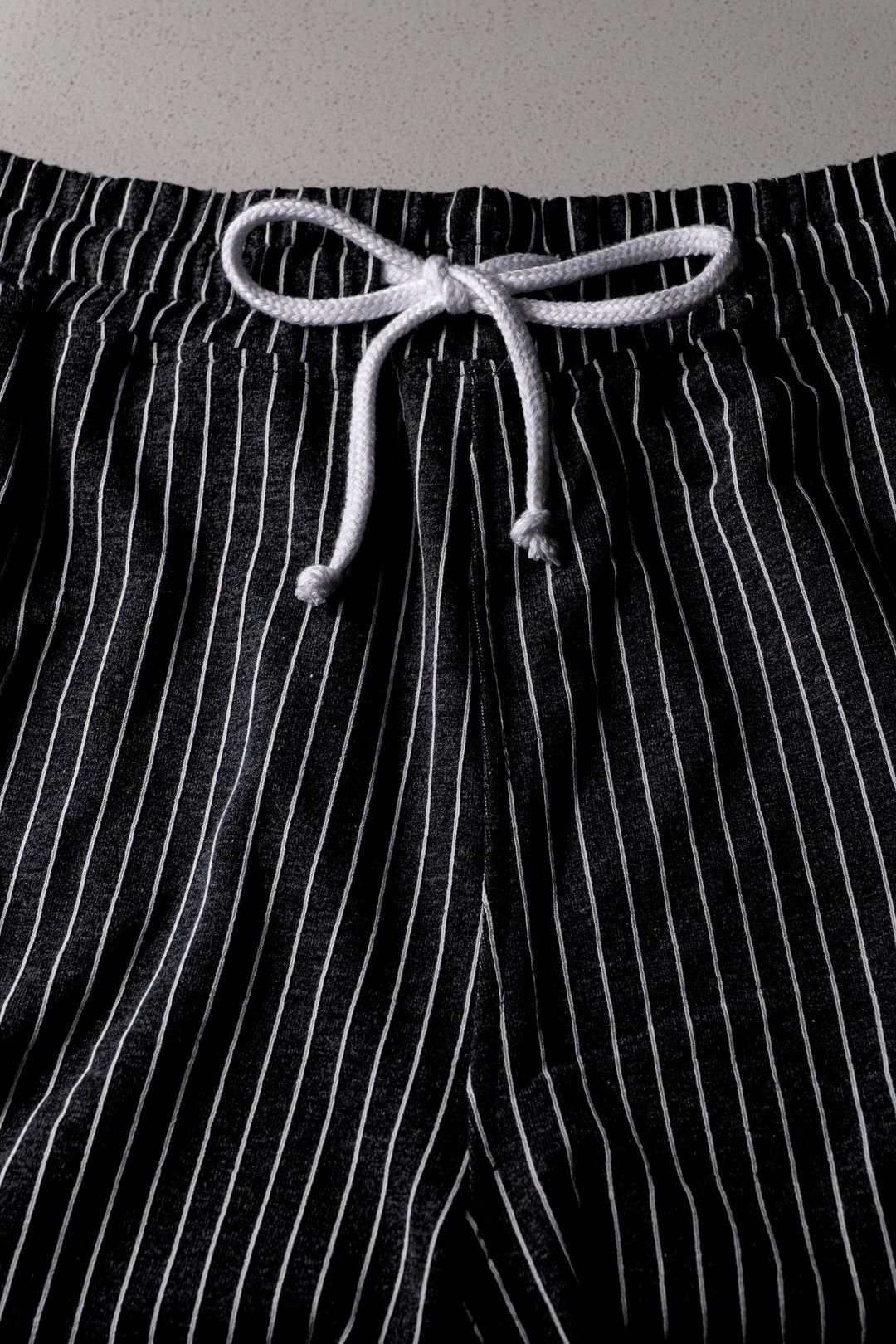 BLACK PIN-STRIPED GYM SHORTS